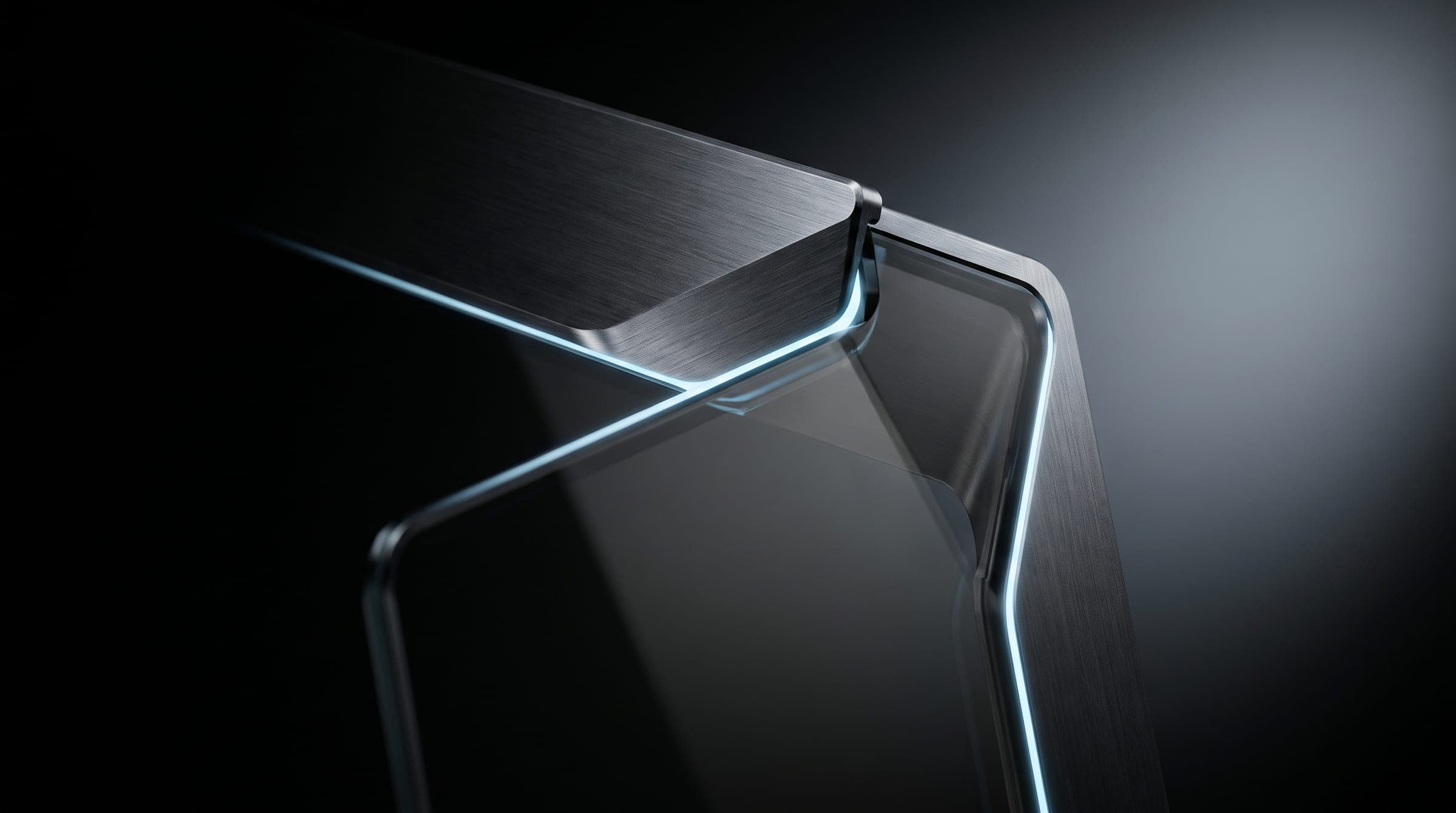 Macro of a machined metal edge over smoked glass with a hairline of ice-blue light